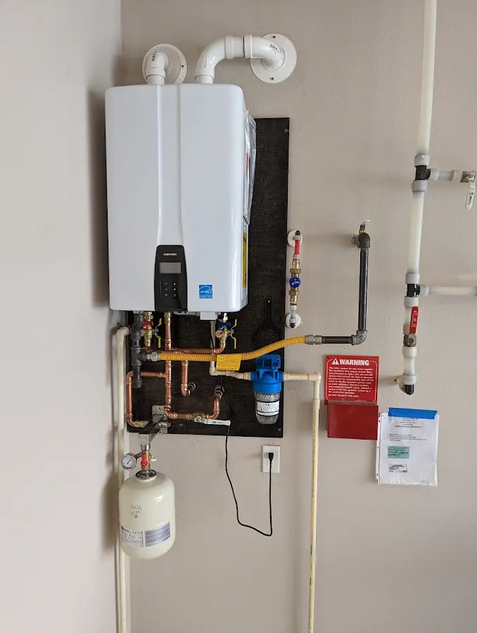 Professional plumber installing copper piping in a Slidell home